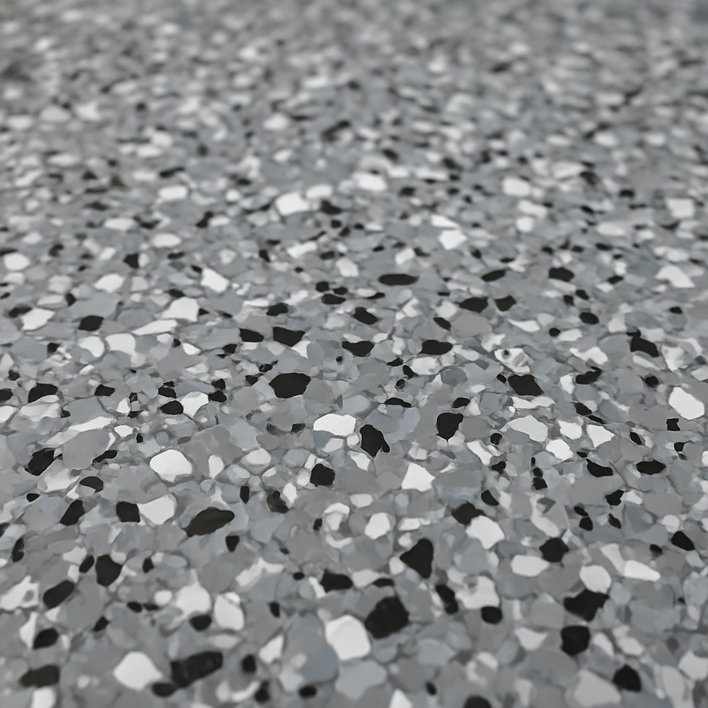 Close-up of gray, white, and black decorative flake floor texture